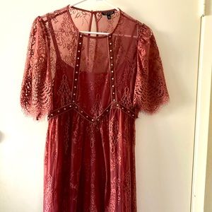 Rose colored lace dress with velvet and chrome tab features.